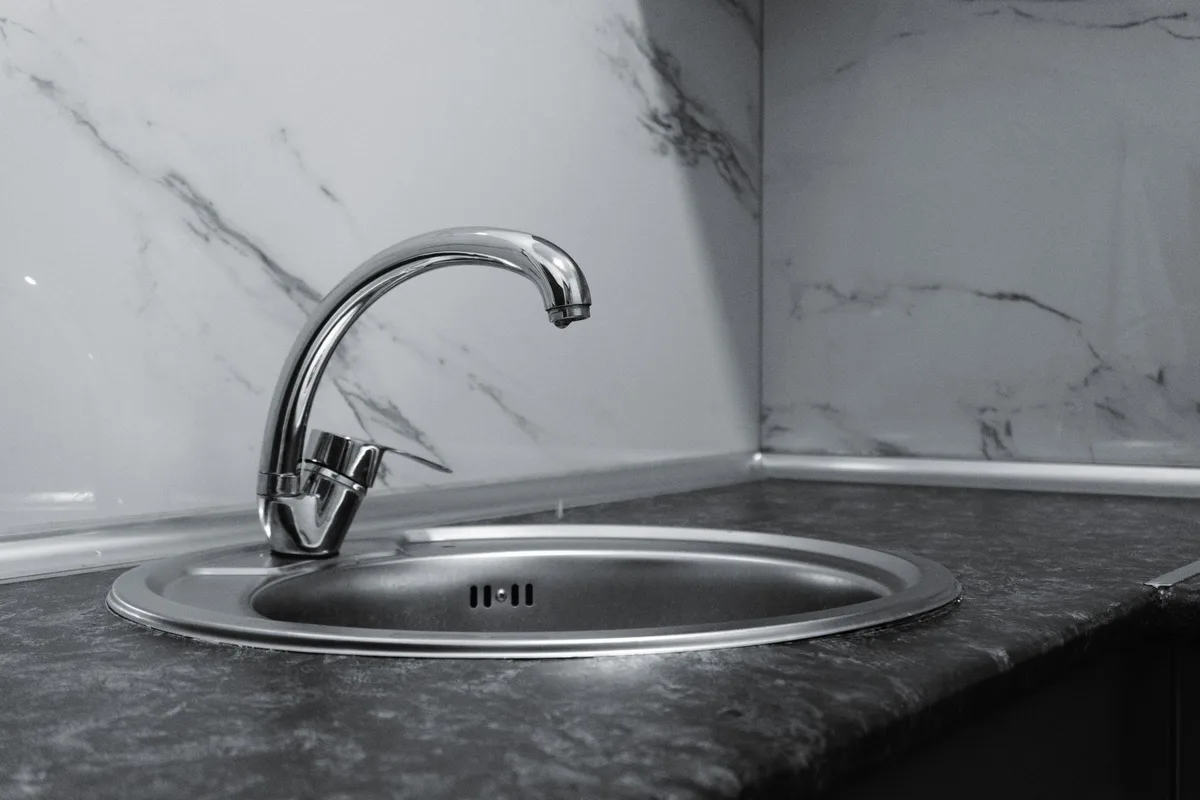 How to Tighten a Loose Kitchen Sink Faucet Base