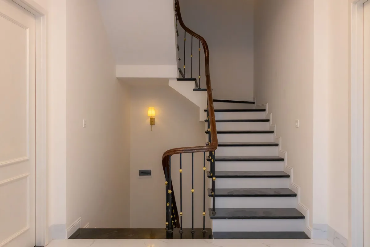How to Add Wall Sconces to a Basement Stairway