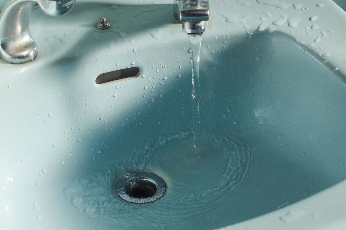 how to clean bathroom sink overflow hole easily
