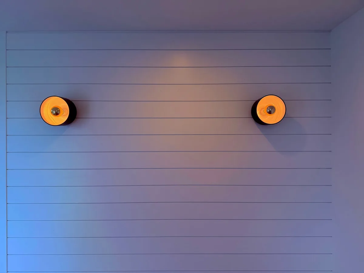 How to Install Wall Sconces on Sloped Ceilings