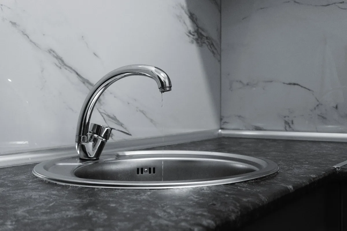 How to Tighten a Loose Kitchen Faucet Base From Underneath